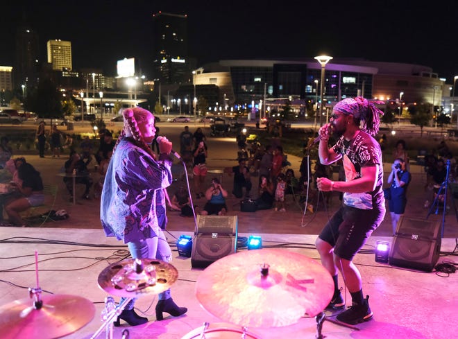 An audience watches performers at the September 2021 Color of Art event at Scissortail Park. Color of Art is a free, family-friendly series of events that combine local music, dance and visual art in an immersive community experience. The 2022 series starts May 22 at Scissortail Park.
